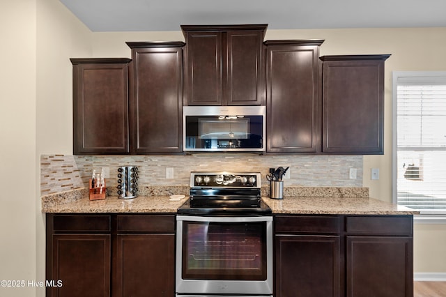300 William Sharp Way, Jacksonville, NC 28546 - kitchen featuring stainless steel appliances, decorative backsplash, and dark brown cabinets