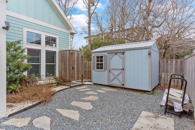 view of shed with a fenced backyard