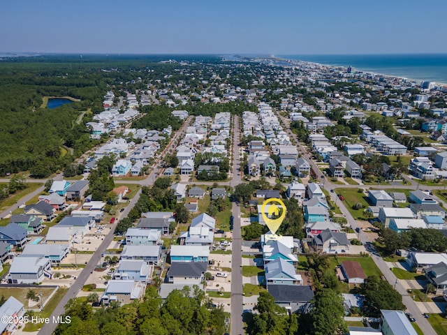 birds eye view of property with a residential view and a water view