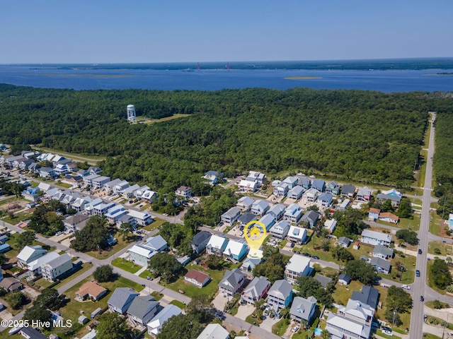 bird's eye view featuring a forest view and a residential view