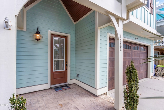 property entrance with a garage