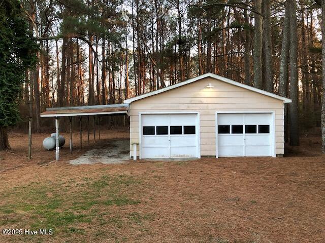 garage with a carport