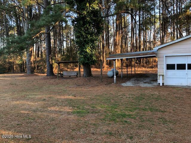 view of yard featuring a garage