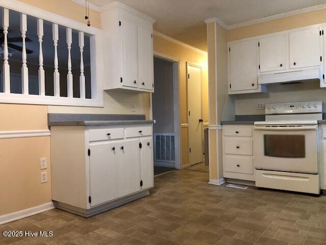 kitchen featuring crown molding, white cabinets, and white range with electric cooktop