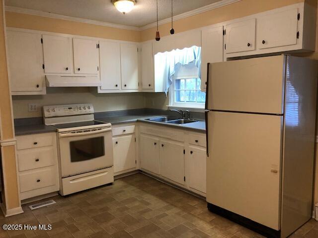 kitchen featuring white cabinetry, sink, white appliances, and crown molding