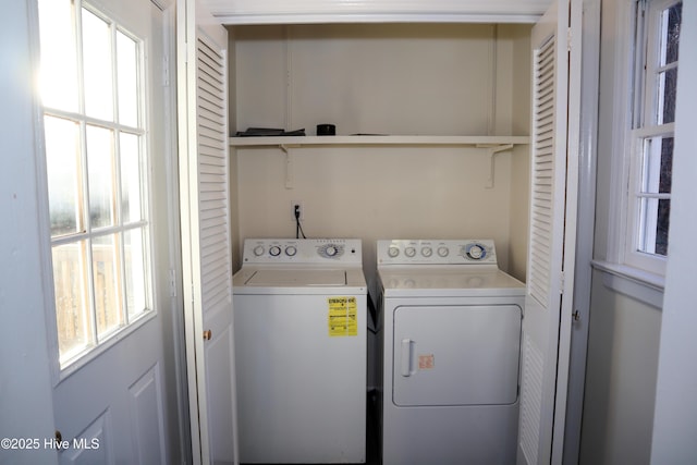 laundry area with a healthy amount of sunlight and washing machine and dryer
