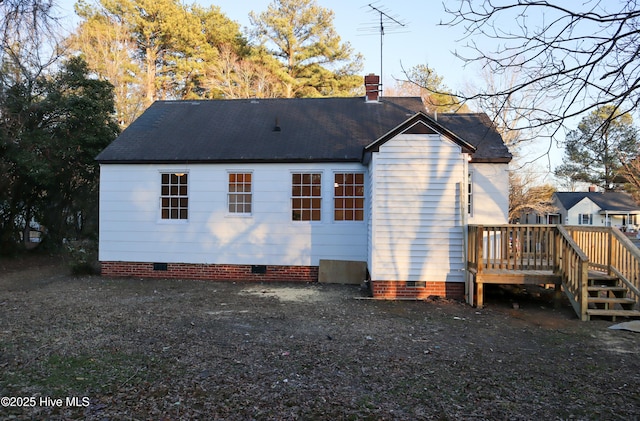 rear view of house with a wooden deck