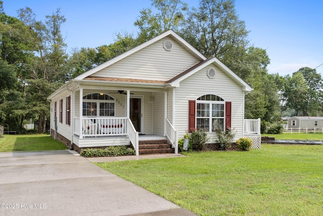 view of front of house featuring a front yard and a porch