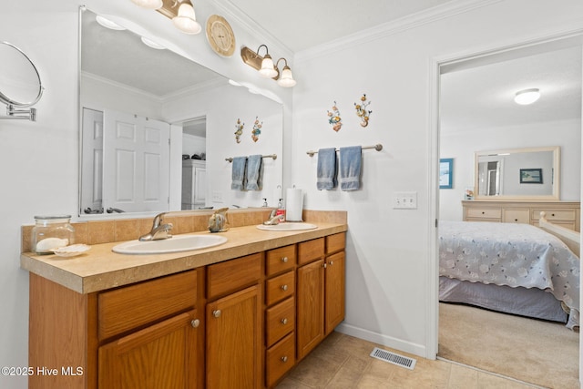 bathroom with crown molding and vanity