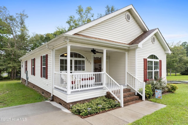 view of front of property featuring a porch, a front yard, and ceiling fan