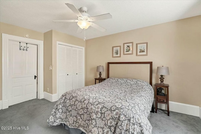 carpeted bedroom with a ceiling fan, a textured ceiling, baseboards, and a closet