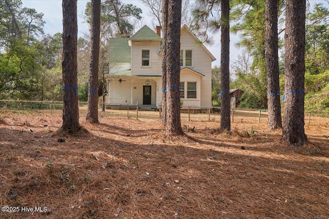 back of property with a fenced front yard