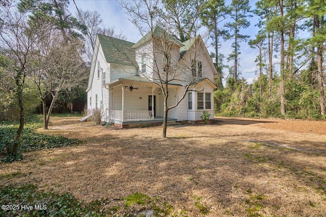 view of side of property with a porch