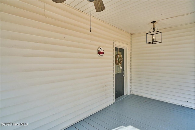 doorway to property featuring ceiling fan