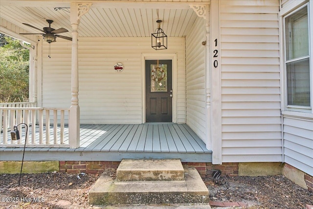 property entrance with a ceiling fan and covered porch