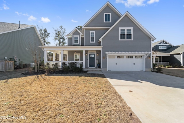 view of front facade with a garage and covered porch