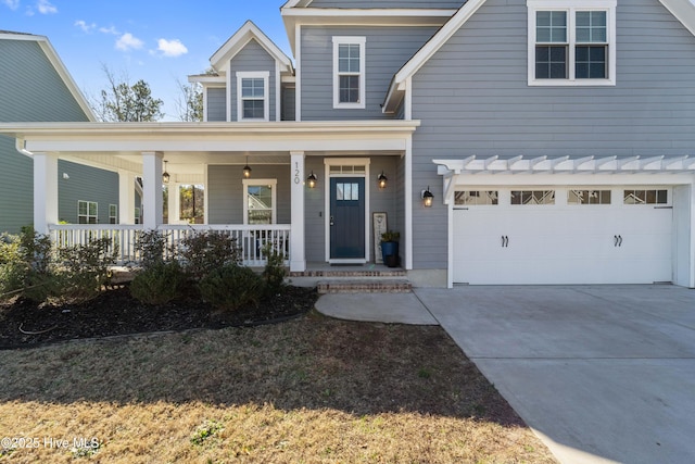 view of front of house featuring a garage and a porch