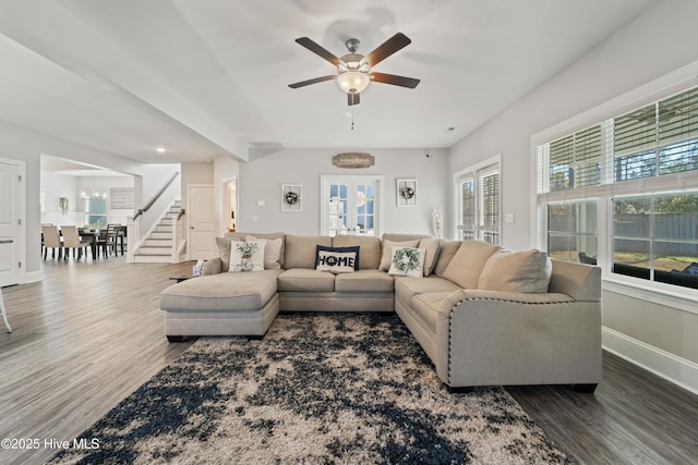 living room with dark hardwood / wood-style floors, ceiling fan, and french doors