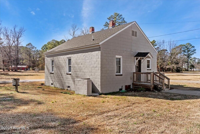 view of property exterior with a yard