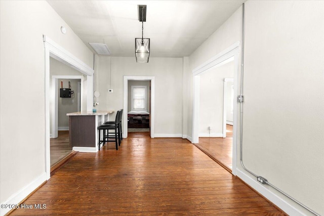 hallway with dark wood-type flooring