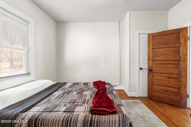 bedroom with light wood-type flooring