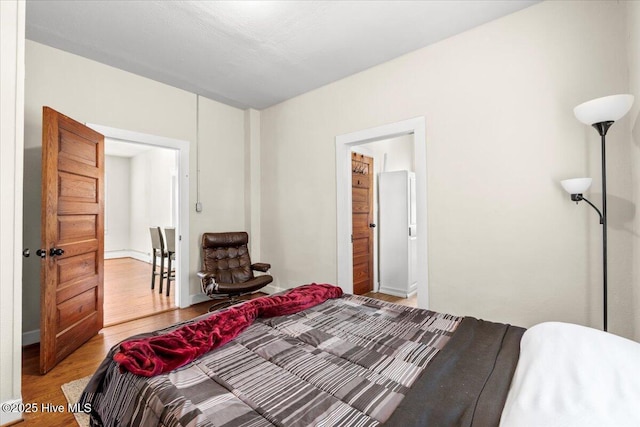 bedroom with light wood-type flooring