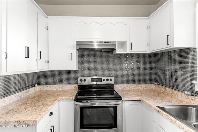 kitchen with white cabinetry, exhaust hood, and stainless steel electric range