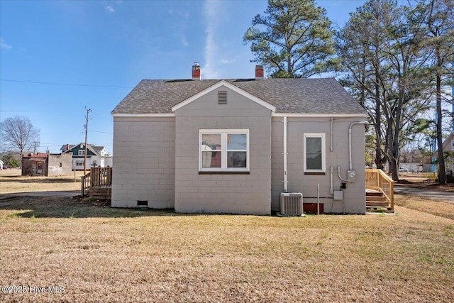 view of property exterior with a yard and central AC