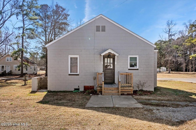 back of house with a yard