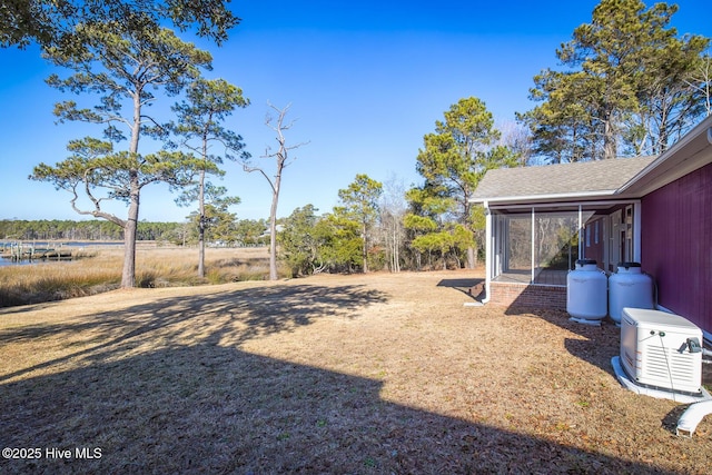 view of yard featuring a sunroom