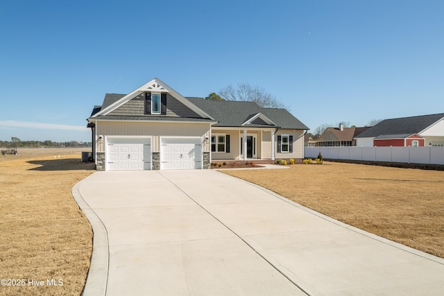 view of front of property with a garage and a front yard