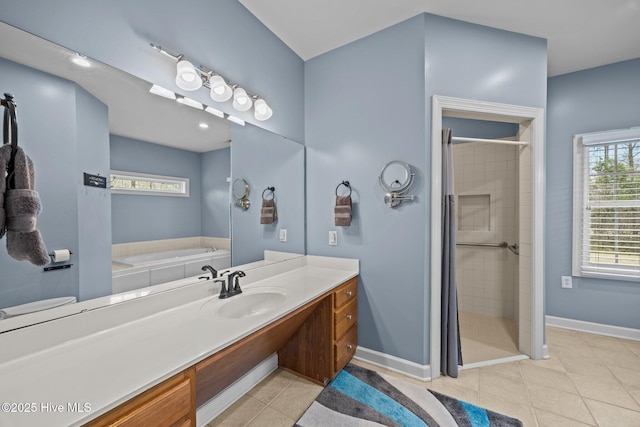 bathroom with baseboards, a stall shower, vanity, and tile patterned flooring