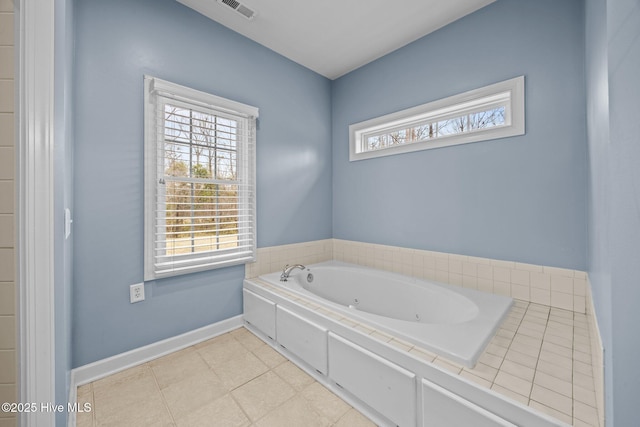 full bathroom with tile patterned floors, visible vents, baseboards, and a whirlpool tub