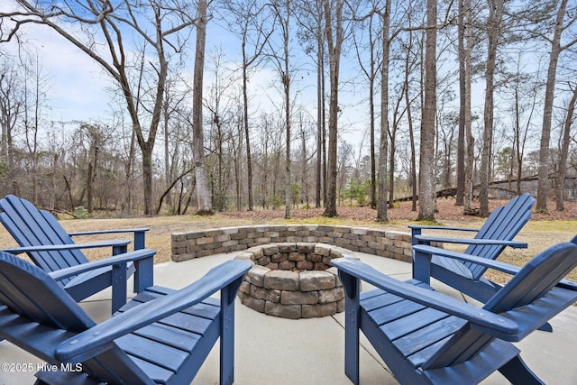 view of patio / terrace featuring an outdoor fire pit