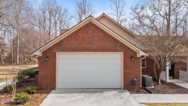 exterior space with central AC and driveway