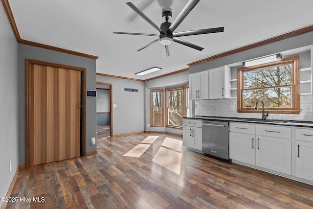 kitchen featuring dark countertops, dark wood finished floors, and dishwasher