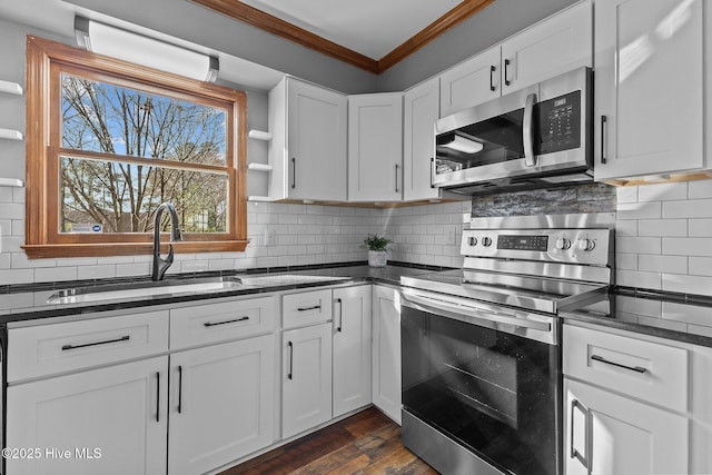 kitchen featuring stainless steel appliances, crown molding, white cabinetry, open shelves, and a sink