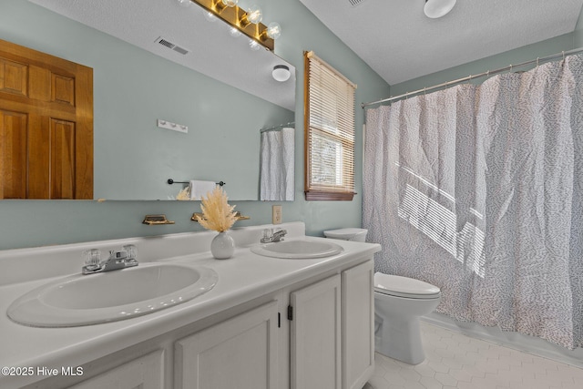 full bath with toilet, a sink, visible vents, and tile patterned floors