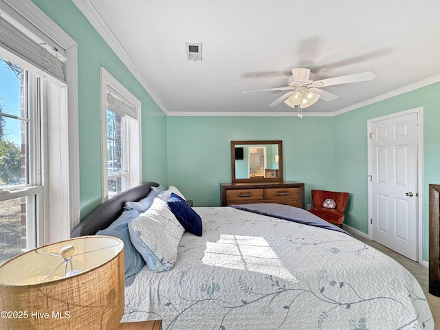 bedroom featuring crown molding and ceiling fan