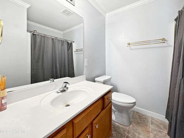 bathroom with vanity, ornamental molding, and toilet