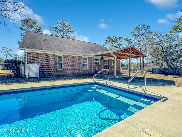 view of swimming pool with a patio area