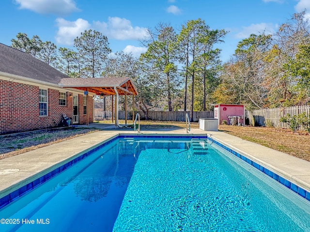 view of pool with a shed