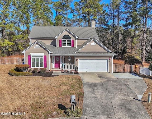 view of front property featuring a garage and a front yard