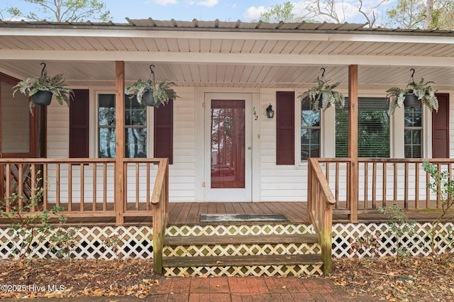 property entrance with covered porch