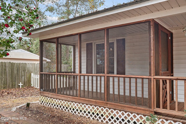 wooden terrace featuring a sunroom