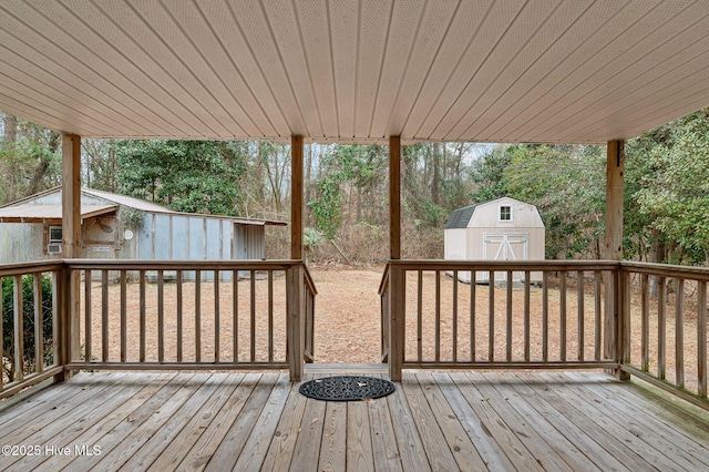 wooden terrace with a storage unit