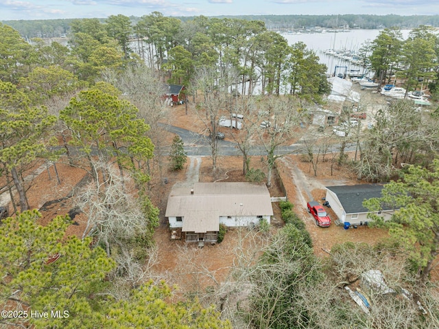 birds eye view of property with a water view