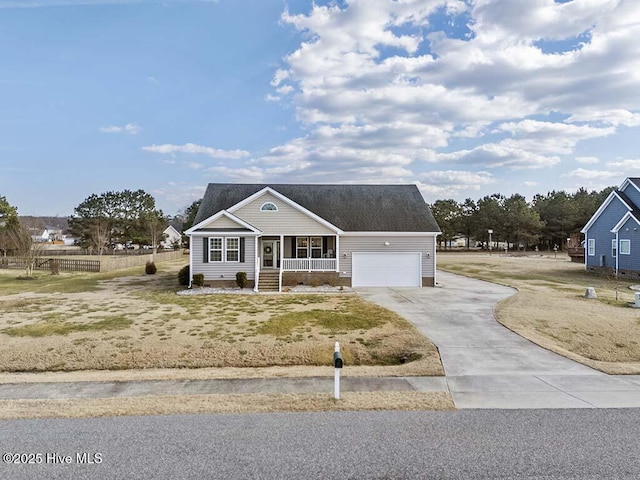 view of front of house featuring a garage and covered porch