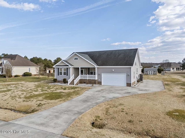 view of front of house with a garage, a front lawn, and a porch