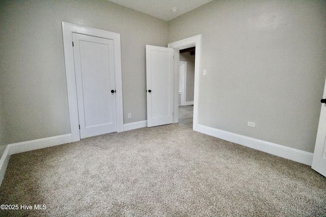 unfurnished bedroom featuring carpet